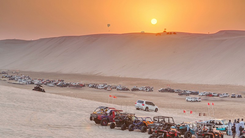 Buggies,In,Sand,Desert,At,The,Sunset,Timelapse.,People,And